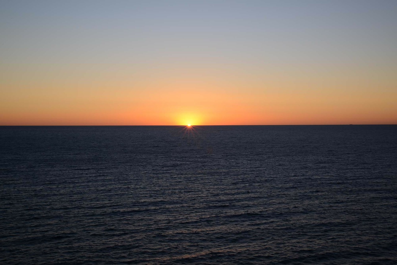 Image - sunrise cloudless ocean orange