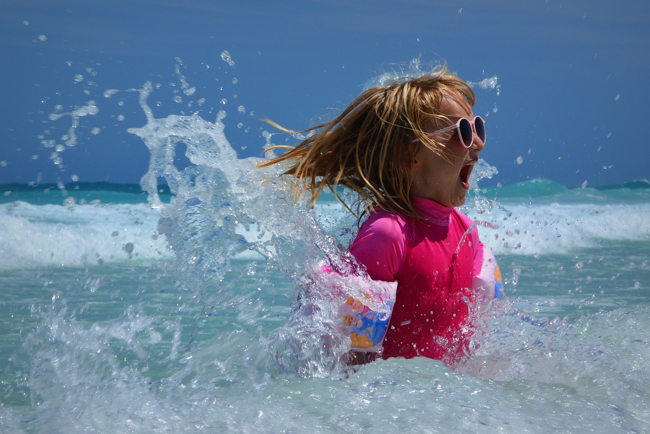 Image - child girl sea waves fun ocean