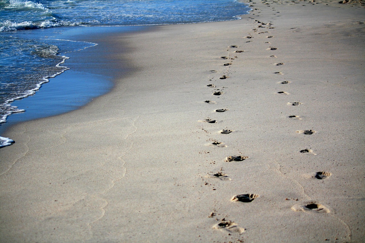 Image - footprints sand sea ocean