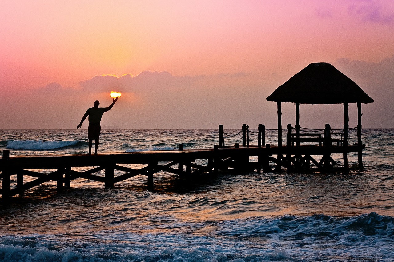 Image - man sun holding ocean peer waves