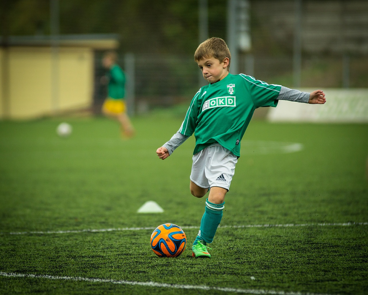 Image - child footballer kick backswing