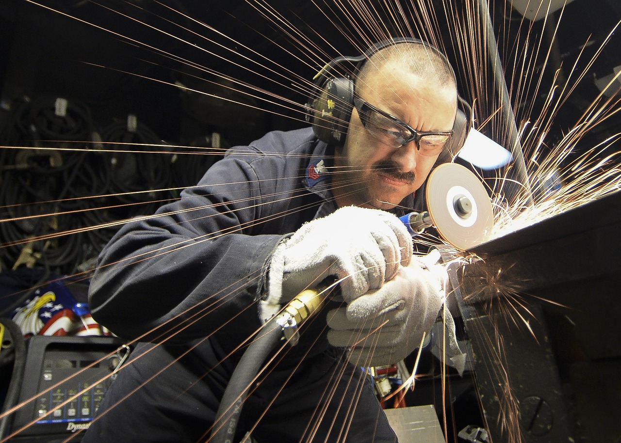 Image - construction worker metal grinder