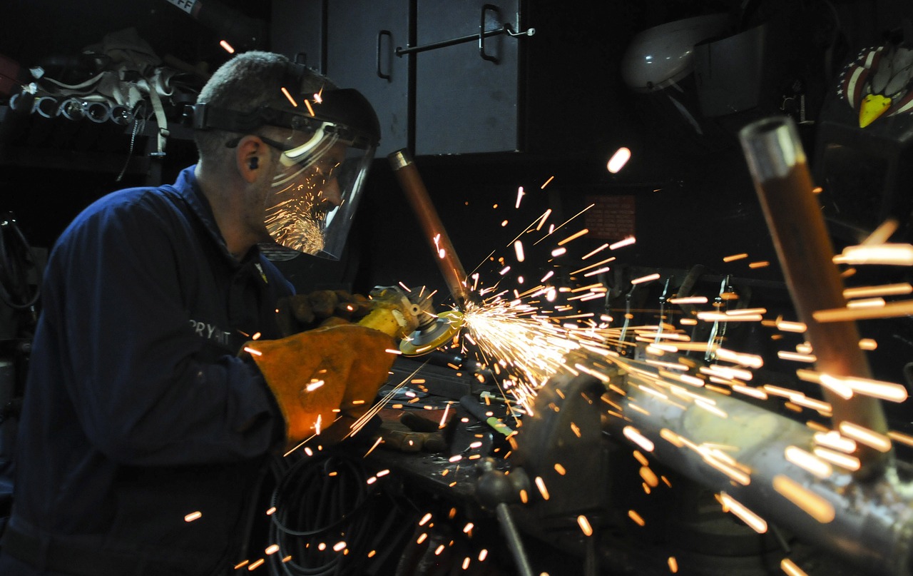 Image - construction worker metal grinder