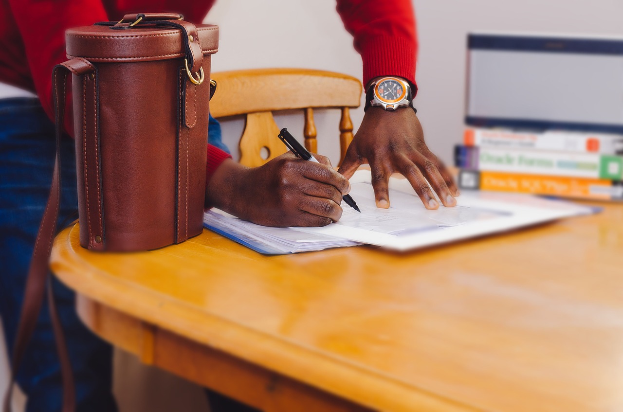 Image - person hands writing paper sheets