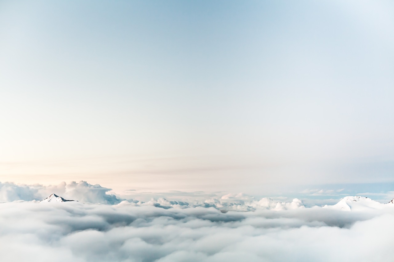 Image - clouds above mountain peak top