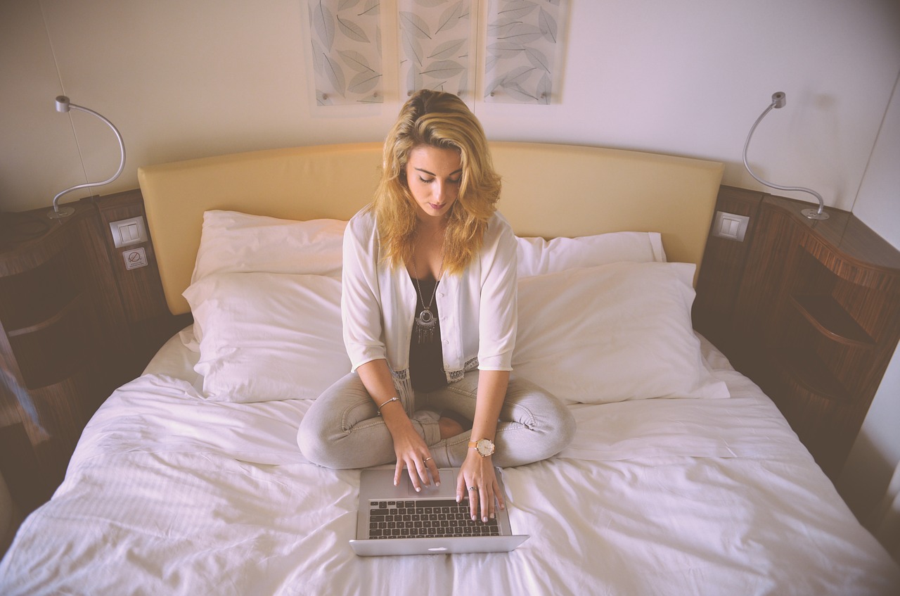 Image - woman working bed laptop typing