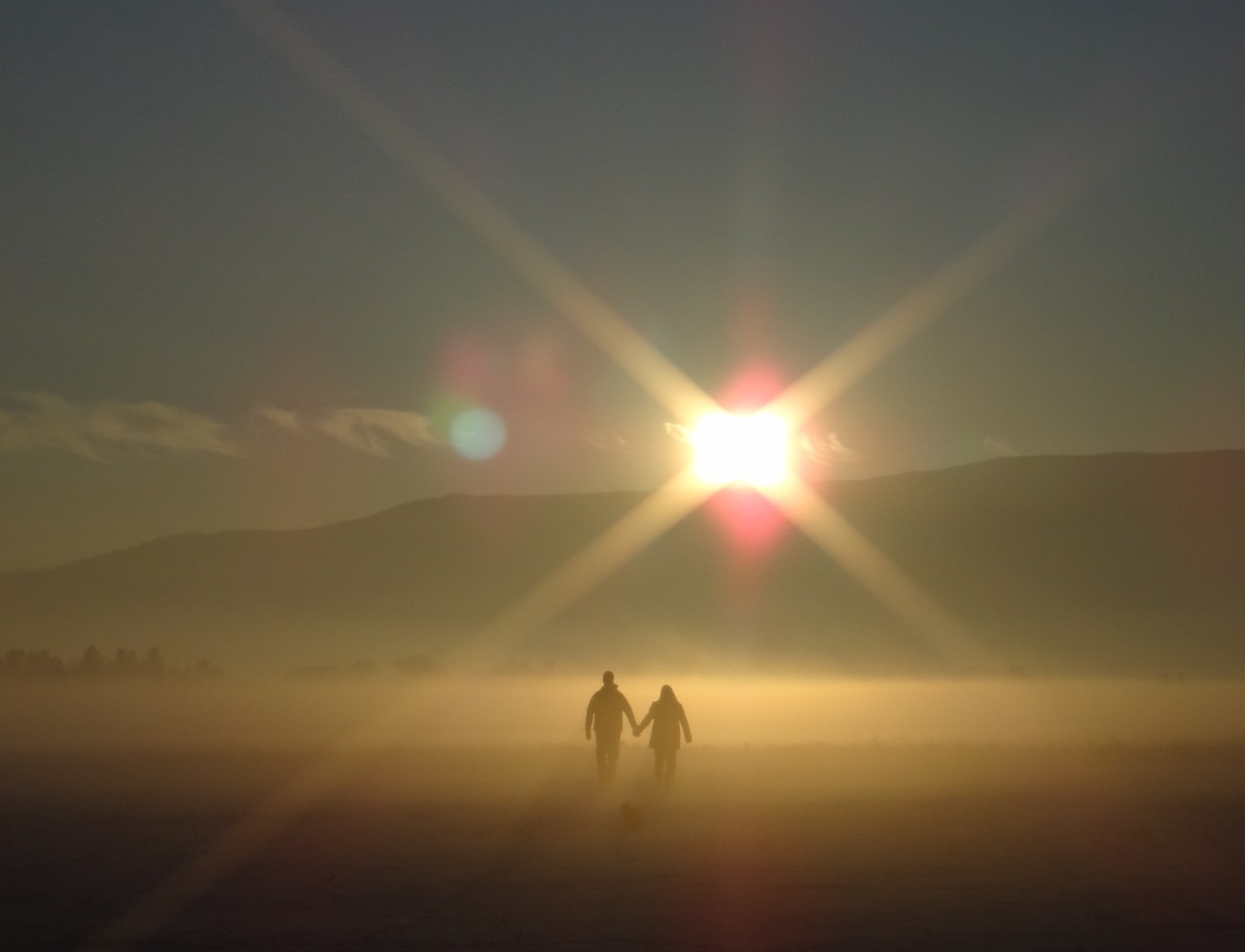 Image - sunset couple holding hands walking