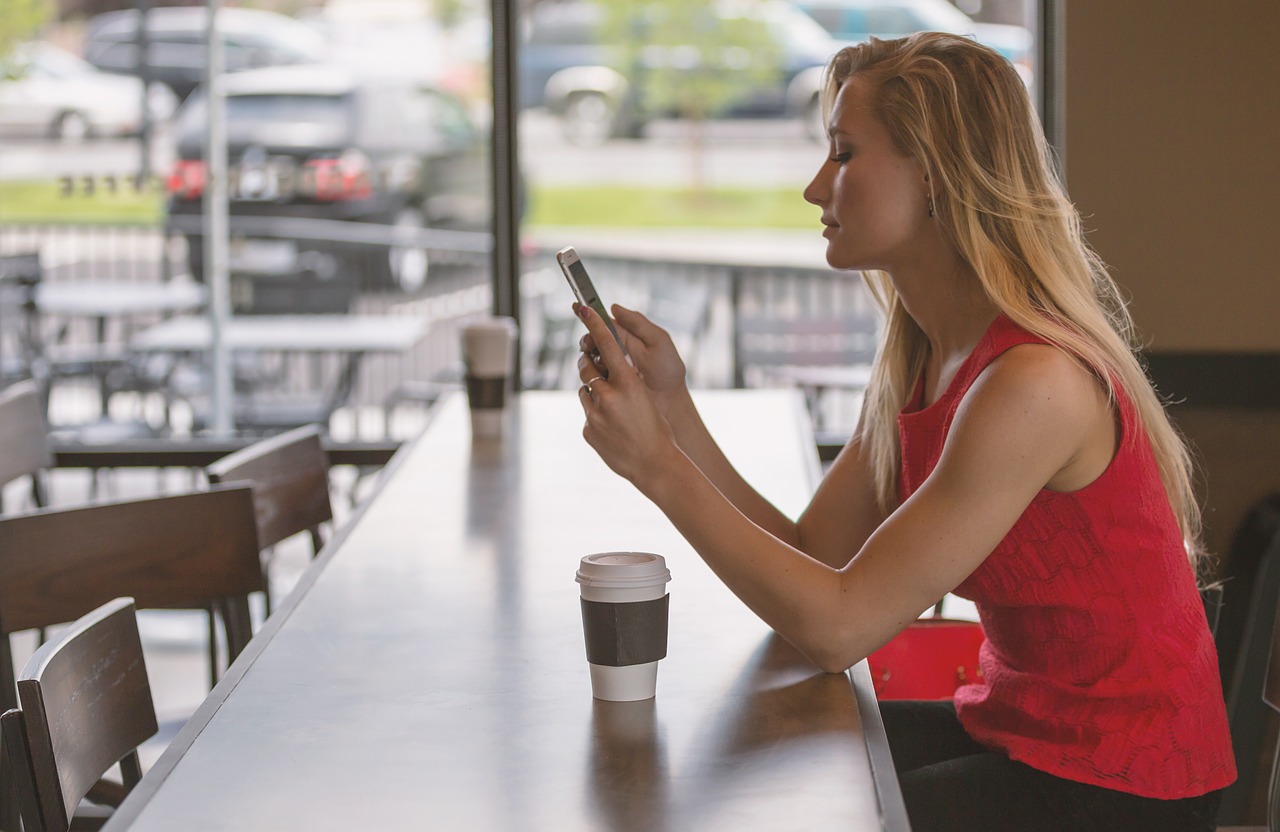 Image - woman sitting counter phone