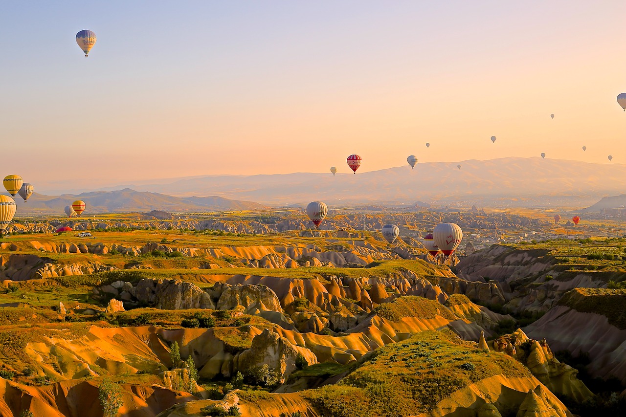 Image - hot air ballons flying above valley