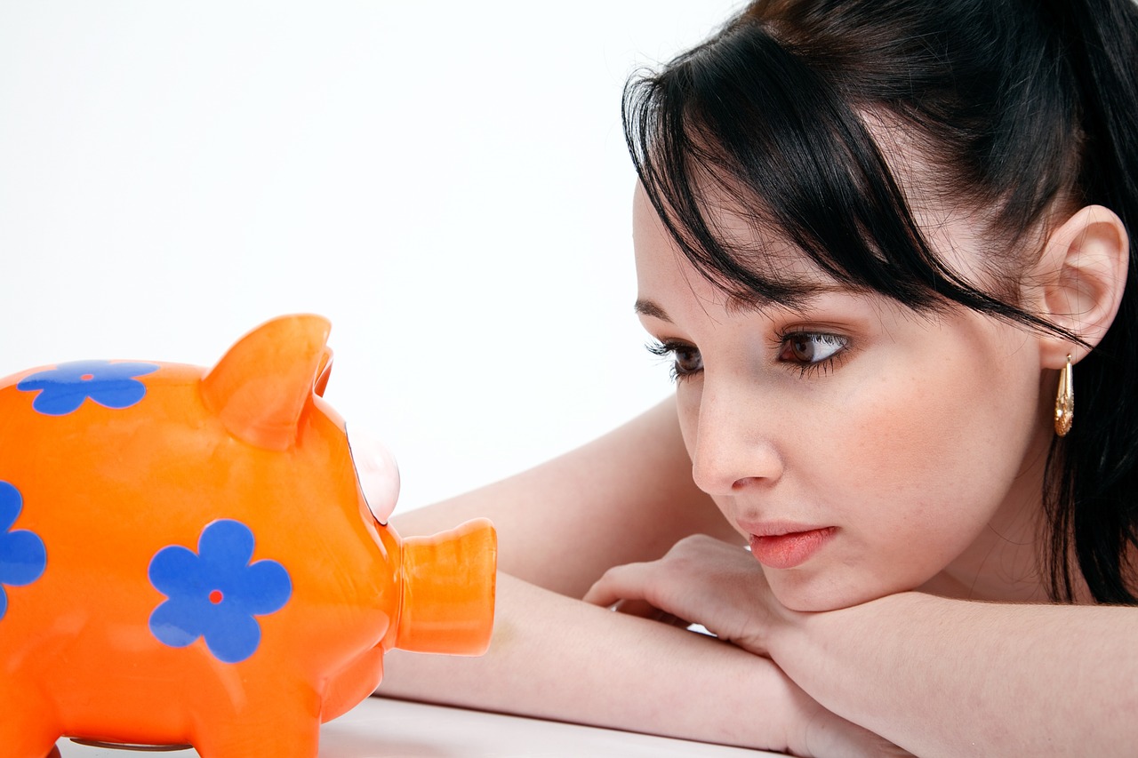 Image - piggy bank saving money young woman