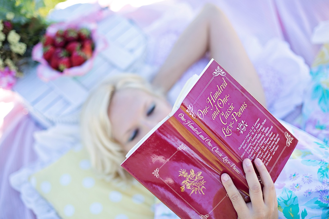 Image - woman reading love poem book picnic