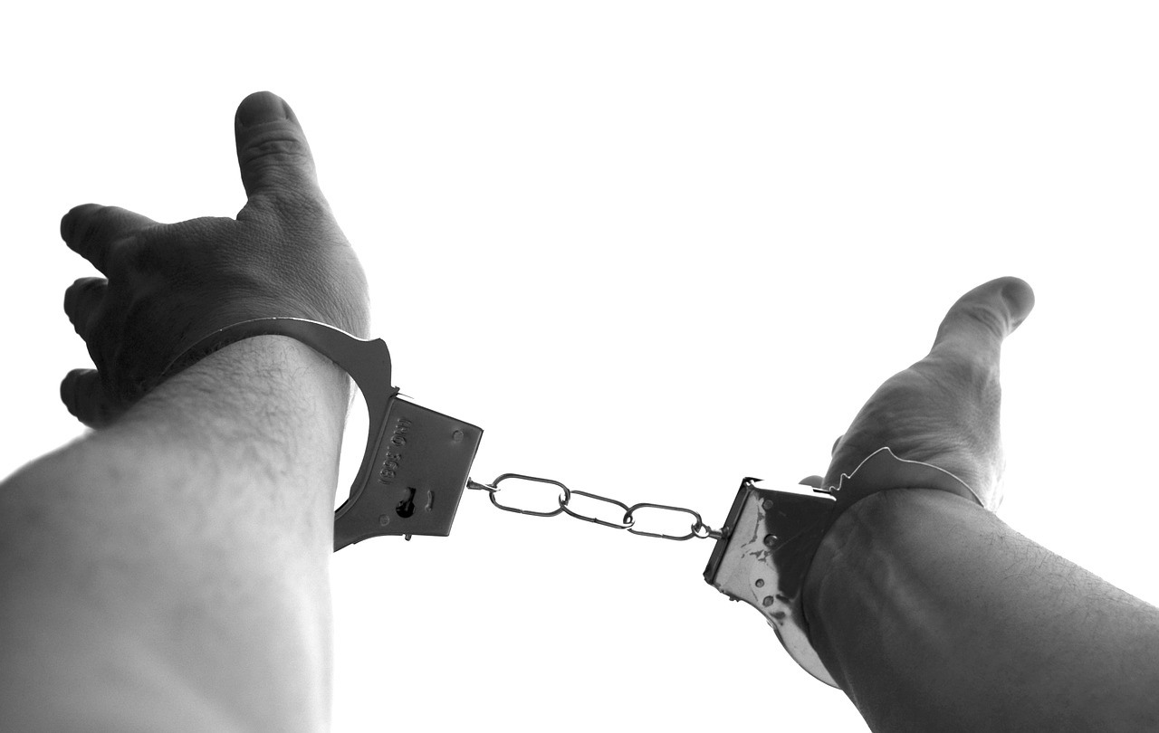 Image - handcuffs caught crime sin