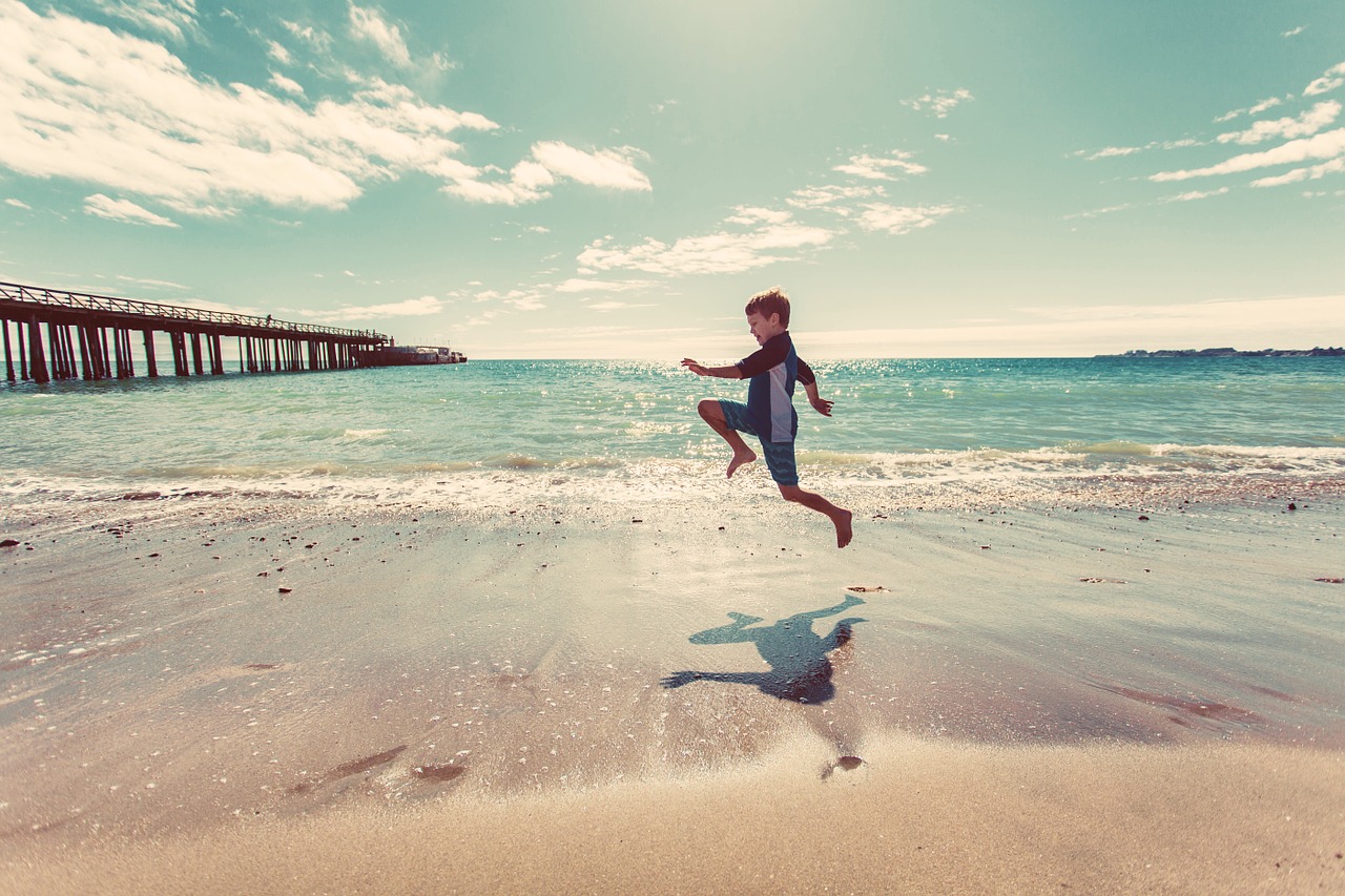 Image - boy beach sand shore water waves