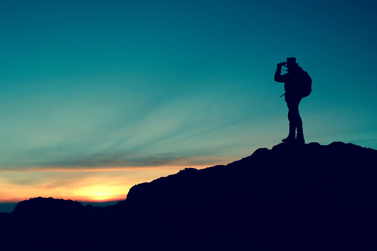 Image - hiker silhouette mountain top