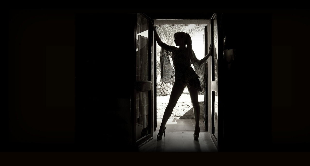 Image - woman standing door silhouette